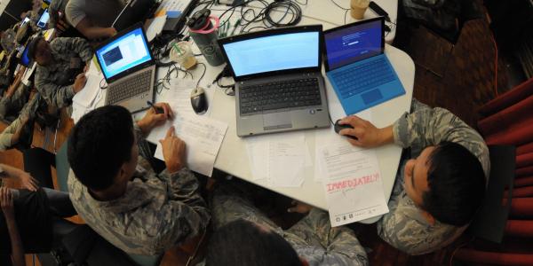 Hawaii Air National Guardsmen evaluate network vulnerabilities during the Po‘oihe 2015 cybersecurity exercise at the University of Hawaii’s Information Technology Center. The cybersecurity exercise is part of a hurricane preparedness effort that encompasses several state and federal government organizations.