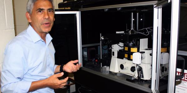 Benji Maruyama, a senior materials research engineer at the Air Force Research Laboratory’s (AFRL’s) Functional Materials Division, stands by the AFRL’s Autonomous Research System (ARES), which uses artificial intelligence to design, execute and analyze experiments at a pace much faster than traditional scientific research methods.