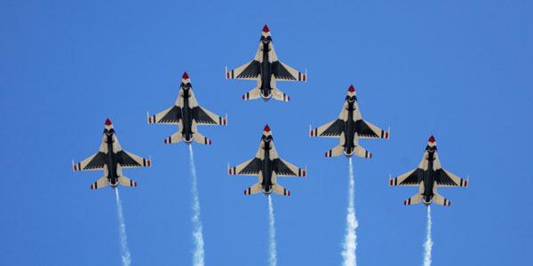 The U.S. Air Force Thunderbirds perform a six-ship formation flyover during an air show. Researchers want to know which indicators of personal performance—heart rate or body sway, for example—begin to synchronize when a team works well together.