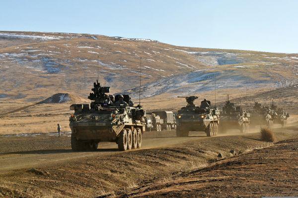 U.S. Soldiers aboard Stryker armored vehicles travel in a convoy past Range 5 in Yakima Training Center, Washington. The Army has seen significant cost savings on some versions of the Stryker vehicle through the Better Buying Power initiative.