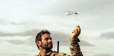 A NATO soldier launches a Prox Dynamics PD-100 nanocopter. The U.S. Army is using the system as a surrogate while developing the Cargo Pocket Intelligence, Surveillance and Reconnaissance system.