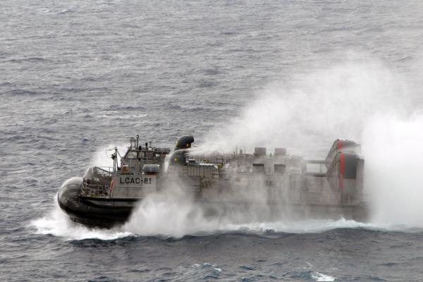 U.S. Navy Landing Craft, Air Cushion 81 departs the amphibious dock landing ship USS Tortuga (LSD 46) during an joint exercise with Japan. Budget chaos could threaten plans to shift forces to the Asia Pacific region while maintaining a presence in the Middle East.