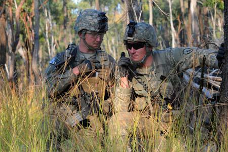 Two U.S. Army soldiers use a tactical radio during a training exercise in Australia. In the future, artificial intelligence could jam enemy radar signals and wireless communications or aid in electromagnetic spectrum management.