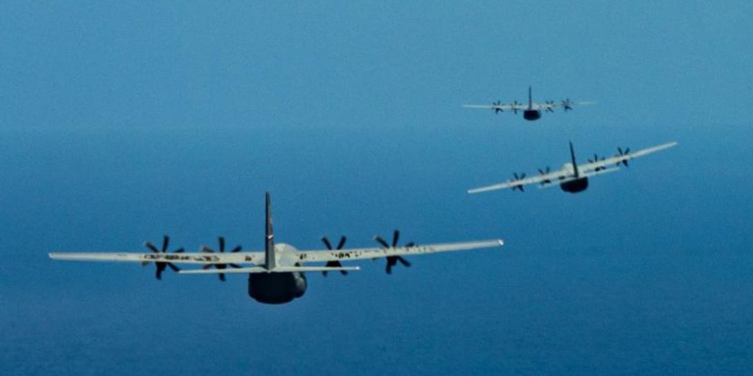 U.S. Air Force C-130J Super Hercules aircraft fly in formation over the Pacific Ocean before an airdrop mission on February 5 during Cope North 2022. Air Force Master Sgt. Joey Swafford