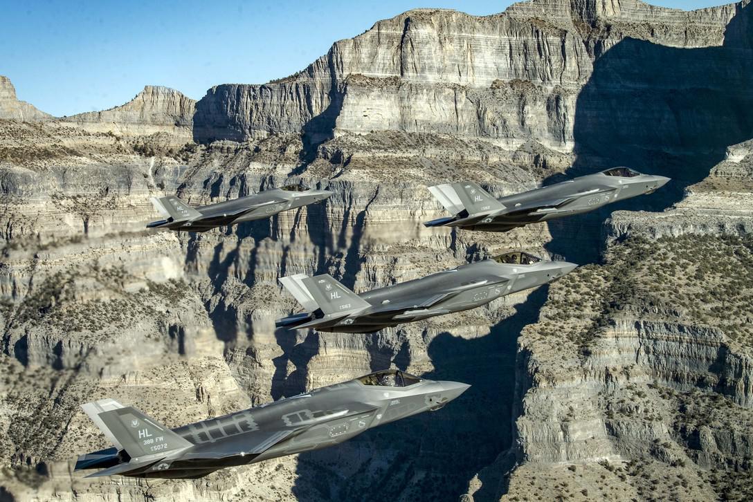 A formation of U.S. Air Force F-35 Lightning IIs perform aerial maneuvers during a combat power exercise over Utah Test and Training Range. The service is using cloud computing and agile software development to deliver software to the field more quickly, which will potentially benefit a wide range of programs and weapon systems.  Photo by Air Force Staff Sgt. Cory D. Payne