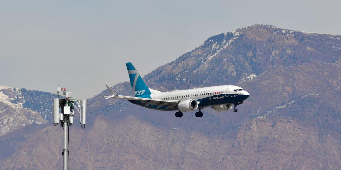 A 5G mobile test station is positioned on the edge of the runway while a Boeing 737 flies multiple passes at different altitudes Feb. 28, 2022, at Hill Air Force Base, Utah. The Defense Department worked with multiple agencies, using one of its 5G test beds and Cell On Light Trucks to test cellular technologies on aircraft radar altimeters U.S. Air Force photo by Todd Cromar