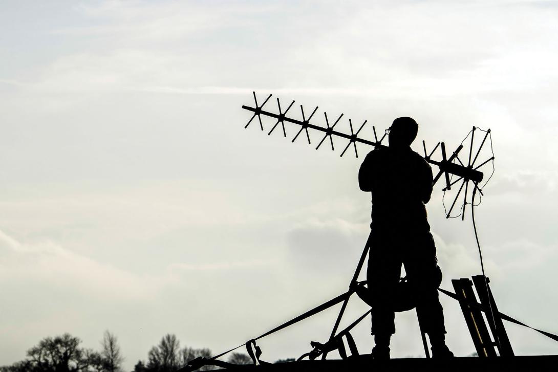 Air Force Airman 1st Class Colin Martin adjusts an antenna while supporting a strategic bomber deployment at Royal Air Force Fairford, England, in January 2018. The modernized encryption chip being developed by the Army C5ISR Center is available for the joint community, including the other services, special forces, NATO partners and coalition forces. Credit: U.S. Air Force photo by Trevor T. McBride