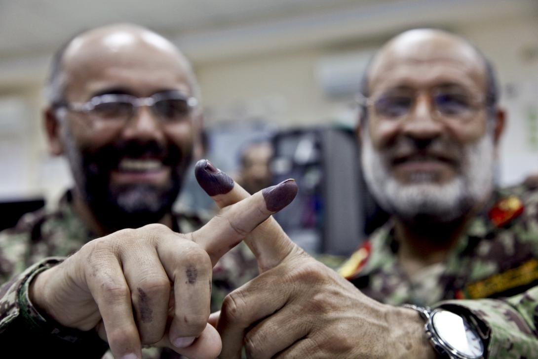 Afghan army officials at Forward Operating Base Gamberi in Afghanistan display the blue ink signifying that they voted in last year’s Afghan presidential election. Intelligence Advanced Research Projects Activity researchers aim to predict major international political events.