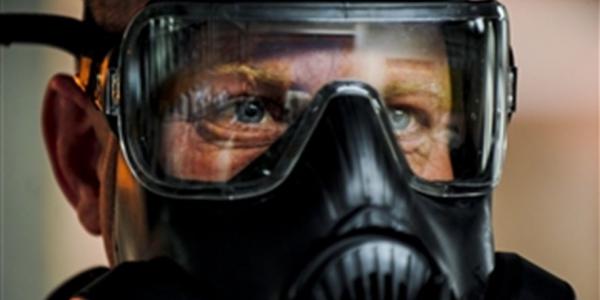 A U.S. Air Force technical sergeant performs breathing techniques during a gas mask fit test to ensure the mask will work properly during emergencies. The JUPITR system is designed to detect pandemics as well as chemical and biological warfare agents against U.S. Forces Korea.