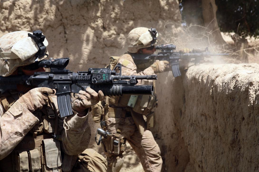 U.S. Marines fire their weapons during an operation in the Helmand province of Afghanistan. A deployed Marine requested the TechSolutions program develop a smart glass solution to allow warfighters to view situational awareness data without taking their hands off their weapons or their eyes off the battlefield.