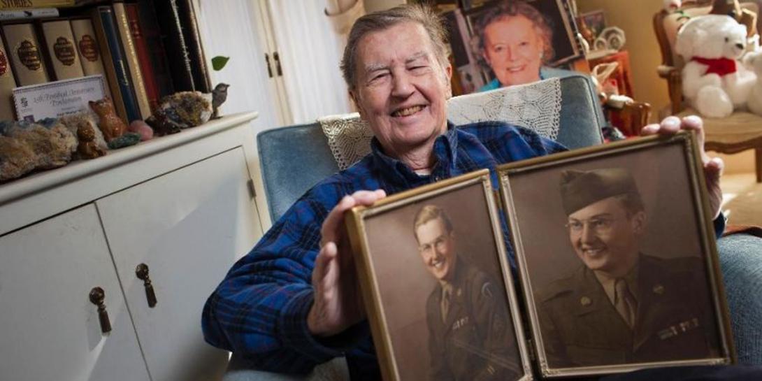 The late Hugh Montgomery, a former ambassador who retired from the CIA in 2014 after serving the intelligence community for more than six decades, displays photographs from his younger days.