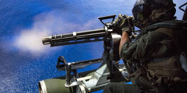 A U.S. Marine Corps corporal fires a GAU-17/A gun during a Valiant Shield exercise over Farallon de Medinilla, Northern Mariana Islands. Machine-learning software may help predict which warfighters will be best suited for specific missions.