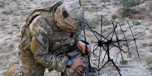 A U.S. Army soldier with the 101st Airborne Division sets up radio communications inside an abandoned fortress in Afghanistan’s Parwan province. Warfighters’ lives often depend on adequate access to radio spectrum. An NSF effort to improve spectrum access will benefit all users, including military, government and industry.