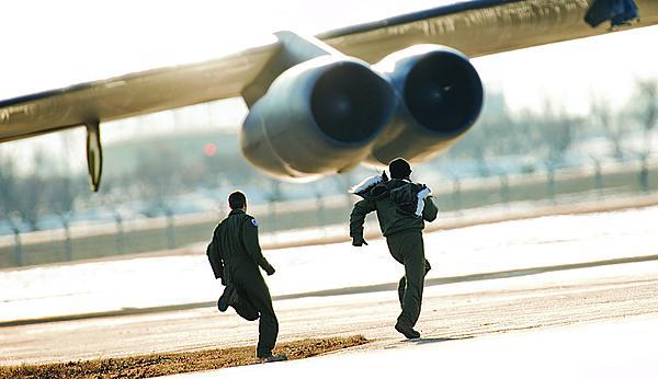 Alerted by the Global ASNT system, aircrews rush to their B-52H Stratofortresses during a training exercise at Minot Air Force Base in November.