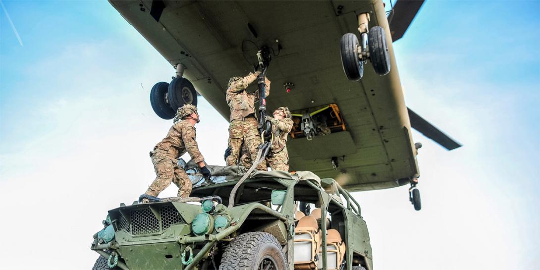 Army paratroopers sling-load a ground mobility vehicle to a CH-47 Chinook helicopter during a September 2019 Saber Junction exercise in Germany. Army officials intend to invest heavily in multidomain operations in the coming years. Credit: Army Sgt. Henry Villarama 