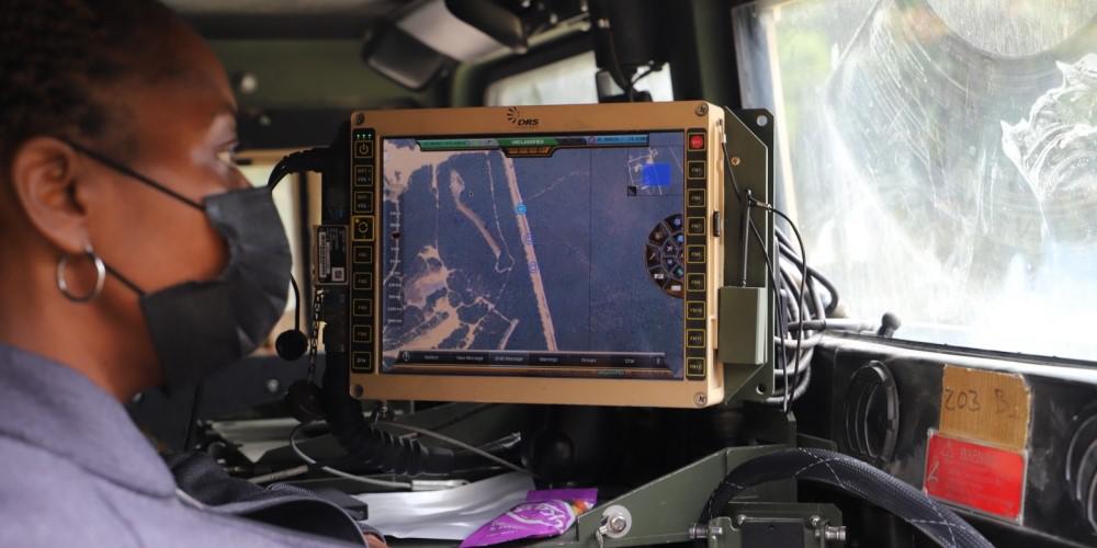 C5ISR Center electronics engineer Michelle Moore studies vehicle positions while evaluating the Blue Force Tracking Resiliency effort during Network Modernization Experiment 20 at Joint Base McGuire-Dix-Lakehurst, New Jersey, September 29. The experiment also included autonomous agents monitoring the network. Credit: U.S. Army C5ISR Center photo/Jenna Mozeyko