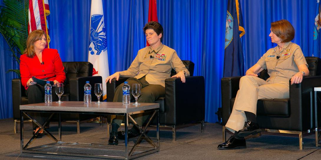 During a February 14 fireside chat at the West Conference, Lt. Gen. Lori Reynolds, USMC, deputy commandant for information, U.S. Marine Corps Headquarters (c), and Vice Adm. Nancy Norton, USN, director, DISA and commander of the Joint Forces Headquarters-Department of Defense Information Network (r), reflect on the challenges facing women in the military. DeEtte Gray, president of U.S. operations, CACI International and chairwoman of the AFCEA board, moderated the event. Credit: Michael Carpenter