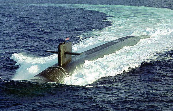 The U.S. Navy’s nuclear ballistic submarine USS MAINE, one of the nation’s newest Ohio class submarines, conducts surface navigational operations approximately 50 miles due south of Naval Station Roosevelt Roads, Puerto Rico. The Naval Research Laboratory’s cryptographic system now destined for aircraft has already been integrated onto the Navy’s nuclear fleet.