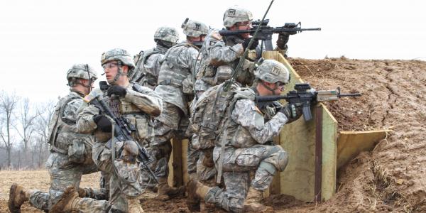 Soldiers from the 101st Airborne Division use Rifleman Radios and other tactical network technologies during a training exercise. In the future, Army officials intend to provide soldiers with a radio capable of using both the Soldier Radio Waveform, which the Rifleman Radio relies on, and the Single Channel Ground and Airborne Radio System waveform.