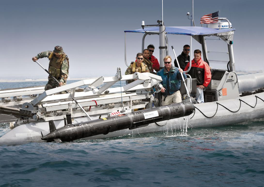 SPAWAR Systems Center Pacific personnel and sailors from Explosive Ordnance Disposal Mobile Unit ONE retrieve an unmanned underwater vehicle deployed to detect mines and improvised explosives in shallow water environments.