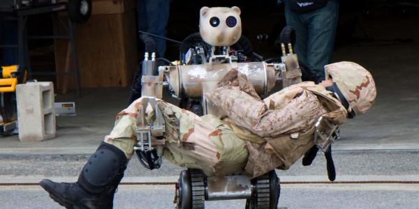 An all-terrain, search-and-rescue humanoid robot at Fort Detrick, Maryland, simulates how a soldier or item up to 500 pounds can be lifted and carried and how it can grasp fragile objects without damaging them. Unmanned systems of the future may be the first to encounter enemy fire.