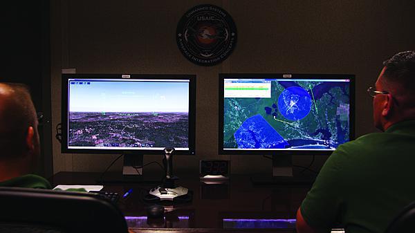 Two unmanned aircraft operators monitor the Ground Based Sense and Avoid System during a recent demonstration at Dugway Proving Ground, Utah.