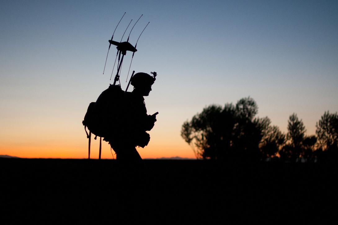 A U.S. paratrooper patrols as the sun rises in a village in Afghanistan’s Ghazni province. Soldiers fighting in future coalitions may benefit from more advanced information systems and distributed analytics.