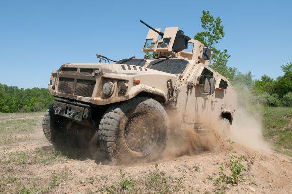 AM General's Joint Light Tactical Vehicle prototype negotiates the off-road demonstration course at the Transportation Demonstration Support Area in Quantico, Va. The yet-to-be-chosen platform is destined to carry the common VICTORY architecture for C4ISR and EW systems.