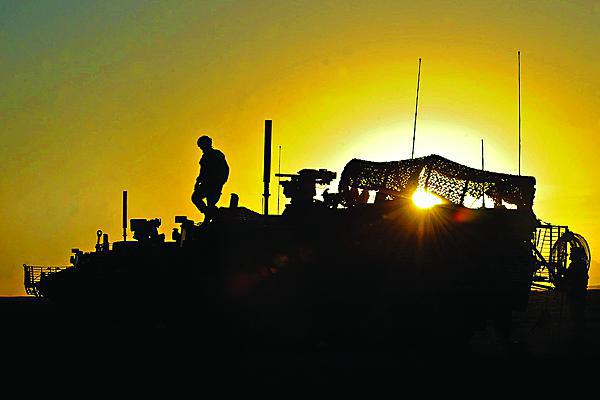 U.S. soldiers dismount a Stryker armored vehicle near the village of Zakuzi in Zabul province, Afghanistan. The Stryker platform is one of several ground combat vehicles receiving the VICTORY information technology architecture.