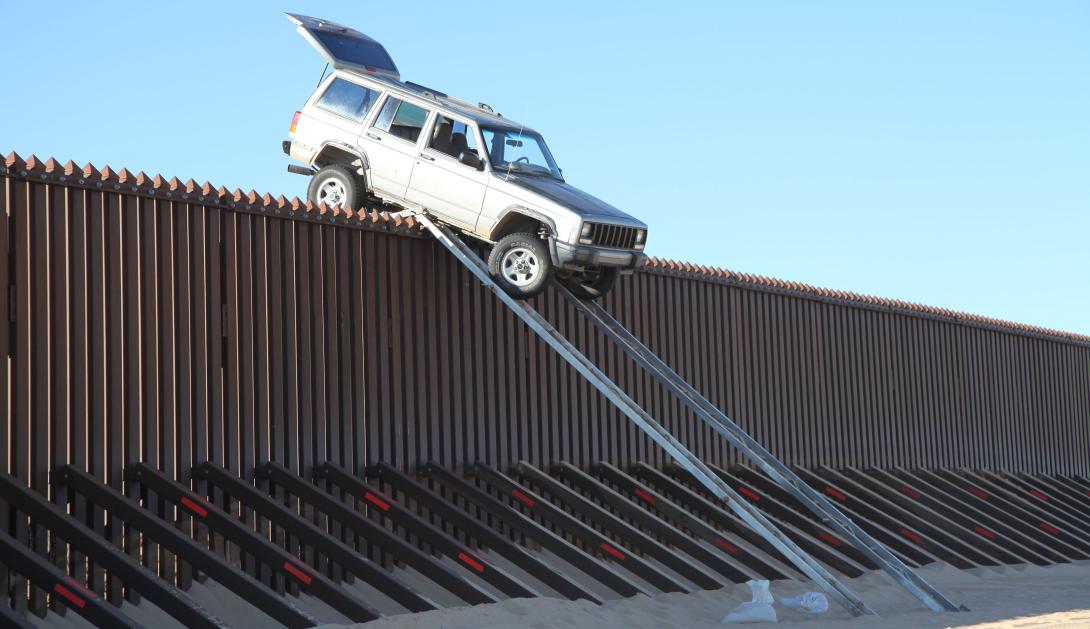 Smugglers used a makeshift ramp to attempt to drive over a border fence in 2012 but fled when the truck didn’t make it over. Jeh Johnson, secretary of the Homeland Security Department, is calling for a 2015 appropriations bill to fund more technology to help secure the southern border.