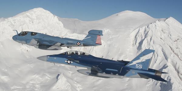 An EA-18G Growler (top) and EA-6B Prowler (bottom) fly together. The Navy is developing a next-generation jammer to be integrated onto the EA-18G, but Frank Kendall warns the United States is falling behind potential adversaries on electronic warfare systems.