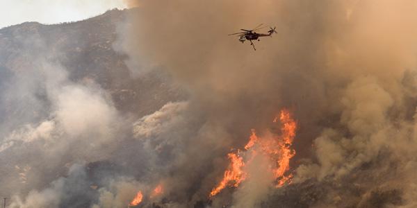 Helicopters drop water and fire retardant on a fire near the Mexican border. AUDREY will provide tailored information to firefighters, whether in the air or on the ground.
