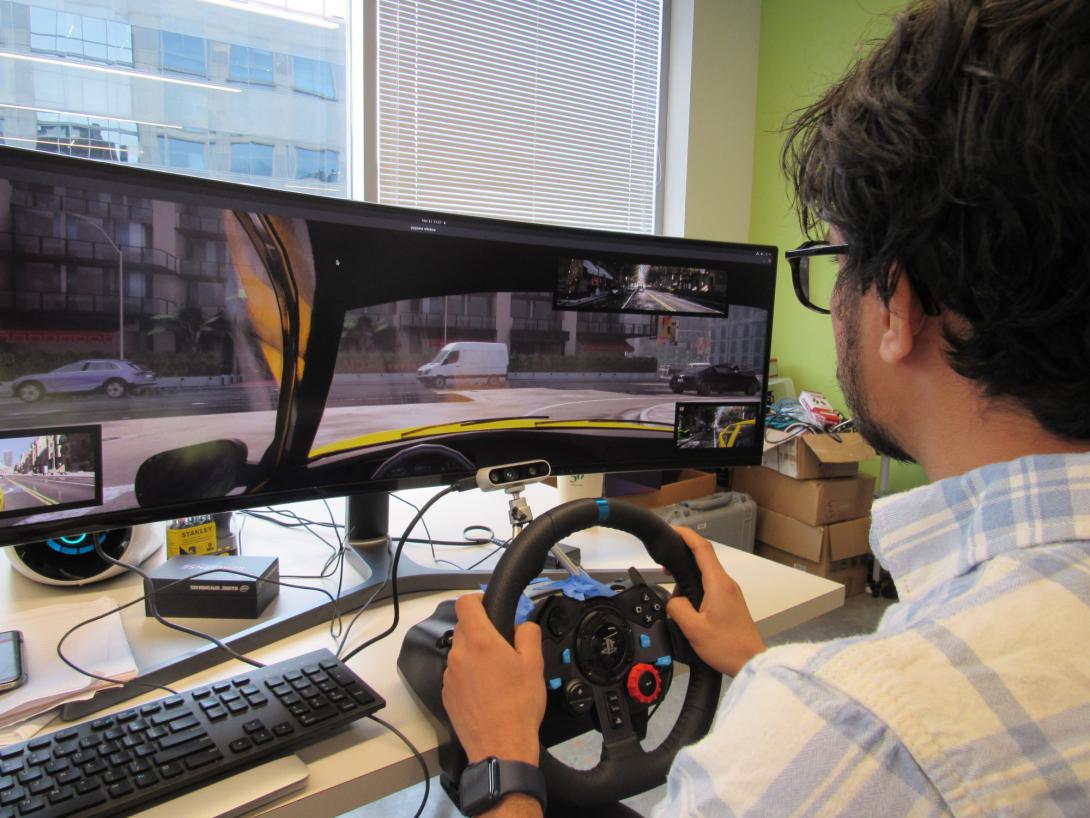 Vikram Adhikari, a third-year computer science PhD student studying at George Mason University’s Department of Computer Science, demonstrates his research of applying a multitude of sensors and cameras in a simulated vehicle. His work studies how analytics, a copious collection of data and the use of sensors can predict—and more importantly curtail—distracted driving.