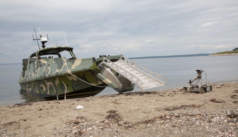 Led by the Naval Surface Warfare Center Indian Head Explosive Ordnance Disposal Technology Division, this simulated mission involves deploying Explosive Ordnance Disposal Unmanned Ground Vehicle (UGV) assets from a converted autonomous Advanced Composite Riverine Craft (ACRC) during the 2017 Advanced Naval Technology Exercise, Narragansett Bay Test Facility, Newport, Rhode Island in August.  David Stoeher, Naval Undersea Warfare Center Division Newport