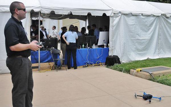 Pat Hickey, an engineer with Galois Incorporated in Portland, Oregon, prepares to fly a mini drone with software rewritten to make it invulnerable to hackers. It is part of the DARPA-funded High-Assurance Cyber Military Systems. By Sandra Jontz 