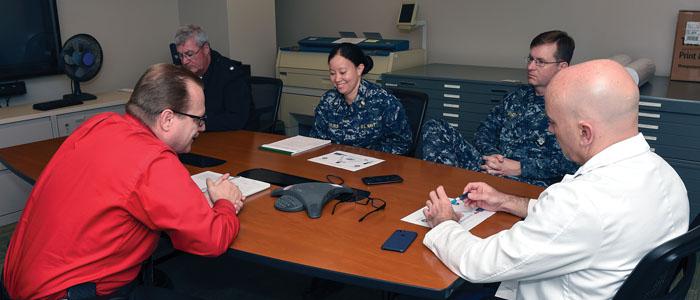 Medical staff from Navy Medicine East and Naval Medical Center Portsmouth, Virginia, communicate with staff from Navy Medicine East’s health care facilities across the Eastern Hemisphere during a virtual health project meeting conference call. Navy Medicine East is one of two regional commands that manage Navy Medicine’s global health care network by overseeing the delivery of medical, dental and other health care services to approximately 1 million patients. Credit: Mass Communication Specialist 2nd Class 