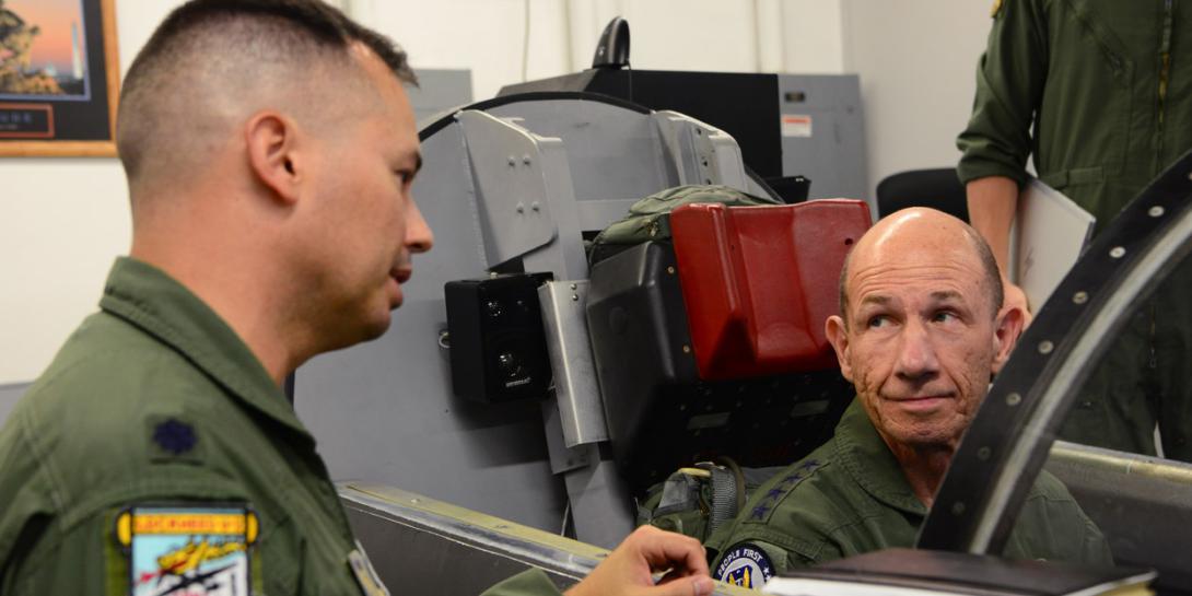 Gen. Mike Holmes, USAF, commander of Air Combat Command (r), receives a brief on U-2 Dragon Lady ejection procedures from Lt. Col. Charles, 9th Operations Group deputy commander, at Beale Air Force Base, California. Holmes visited the 9th Reconnaissance Wing, where he was immersed in all aspects of the reconnaissance mission. U.S Air Force photo by Senior Airman Tristan D. Viglianco