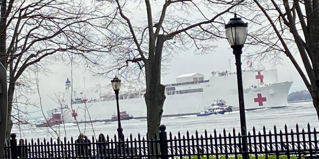 The Navy hospital ship USNS Comfort heads up the Hudson River to take its position at a midtown pier to serve as a support hospital for New York City health facilities overwhelmed with COVID-19 coronavirus patients. Navy engineers worked feverishly to upgrade or repair communications systems just before it set sail. Credit: Elizabeth Natrella