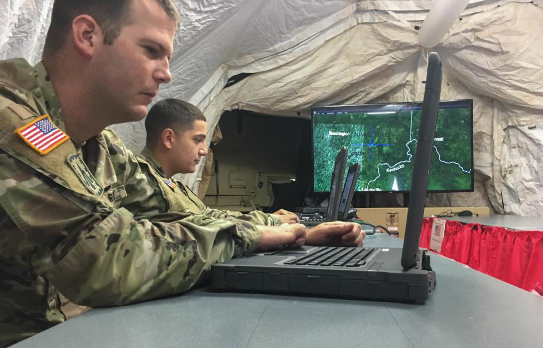 Soldiers track an airborne threat from within a tent during an exercise. Zero-trust implementation will be even more vital to military forces as networks rely on the cloud to move important data to the tactical edge. Credit: Sgt. Sarvesh Regmi, USA/Capt. Adan Cazarez, USA
