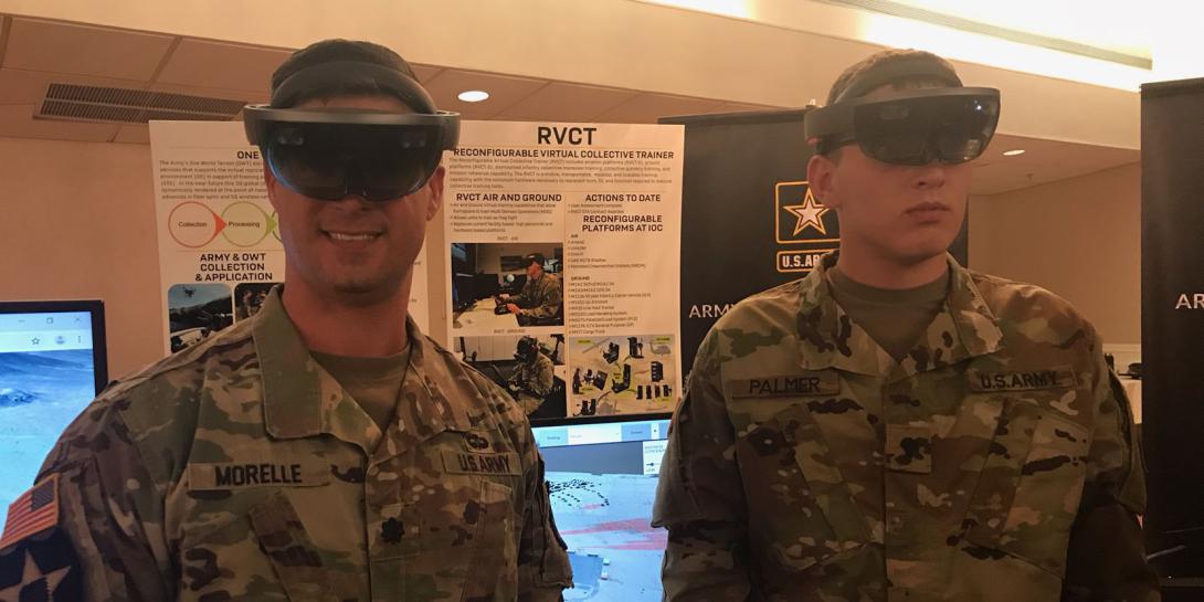 Lt. Col. Dylan Morelle (l), USA, demonstration officer, Synthetic Training Environment Cross-Functional Team and Spc. Cody Palmer, USA, 2nd Armored Brigade Combat Team, 1st Infantry Division, demonstrate the Army’s One World Terrain platform.