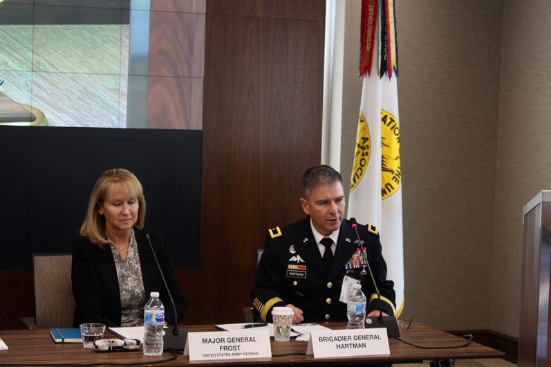 Newly retired Maj. Gen. Patricia Frost, USA, and Brig. Gen. William Hartman, USA, deputy commanding general, U.S. Army Cyber Command, discuss lessons learned from the establishment of the Army’s Cyber-Electromagnetic Activities (CEMA) teams. Photo credit: Anna Neubauer