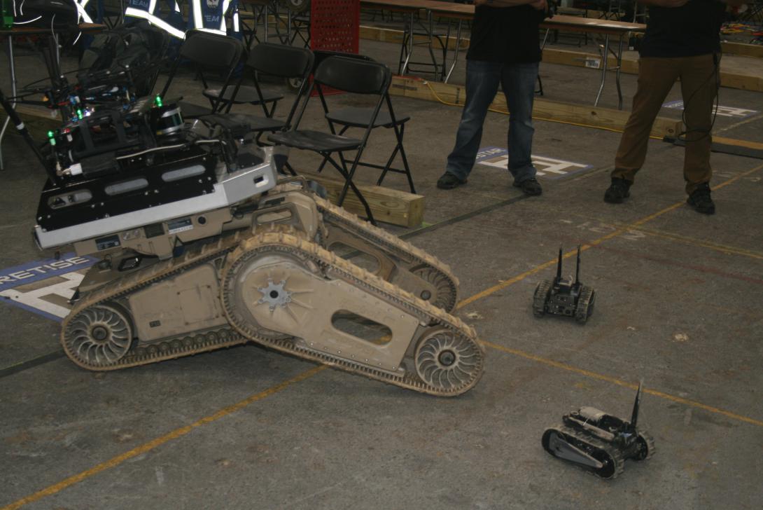 To extend its underground communications network, Team Cretise relies on a large tracked robot that carried a drone and mini robots into the mine.