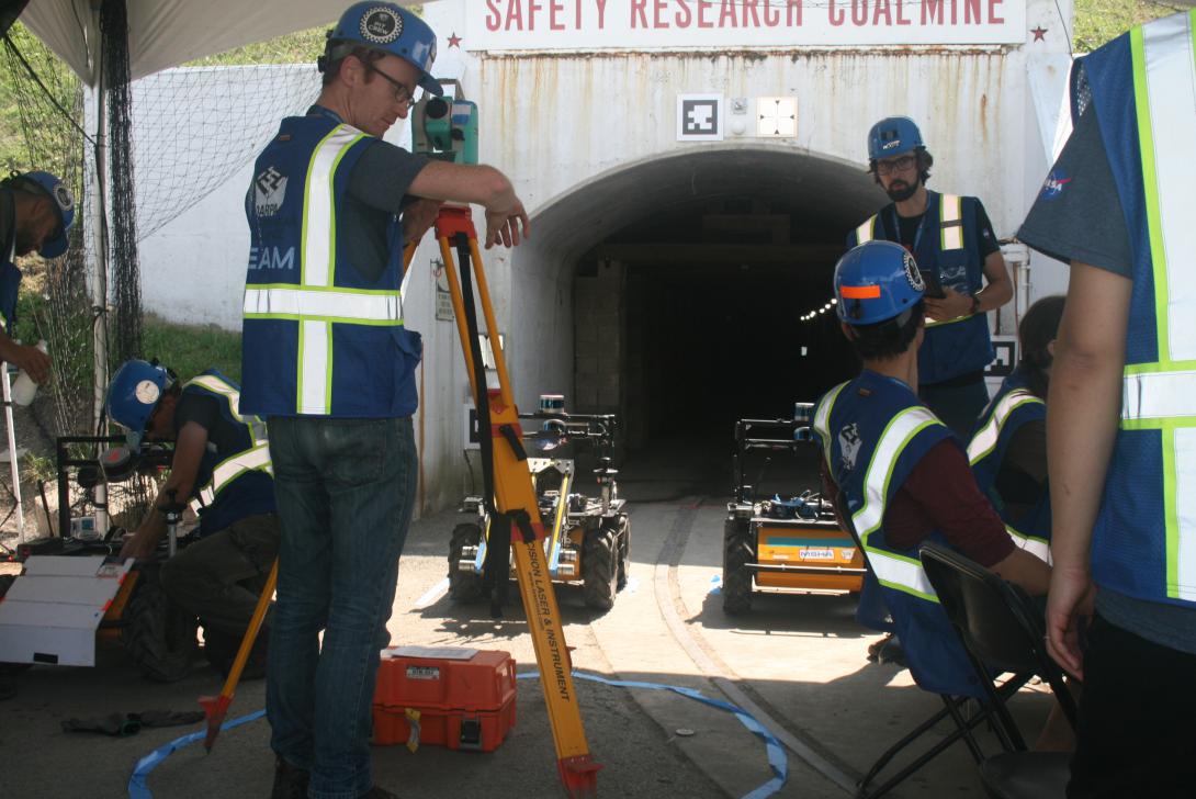  Researchers from the Jet Propulsion Lab, California Institute of Technology, Massachusetts Institute of Technology and South Korea's KAIST Center, representing the CoStar Team, await to deploy additional ground robots into the coal mine tunnel on August 20 during DARPA's Subterranean Challenge.