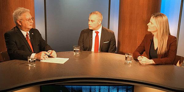 SIGNAL Magazine Editor in Chief Robert K. Ackerman (l) discusses data protection with Jonathan Alboum, Veritas Technologies and Sherry Bennett, DLT Solutions.