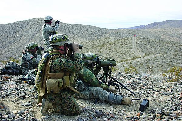 U.S. Army and Marine forward observers train jointly at the National Training Center in Fort Irwin, California. Joint operations will continue to be a challenge without top-down coordination to ensure interoperability early in system development.