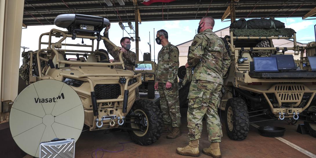 The ability to conduct Joint all domain command and control is absolutely essential to face the threat from China, leaders say. U.S. Air Force Staff Sgt. Christopher Watson, 25th ASOS Radio Frequency Transmissions craftsman, left, briefs Gen. Ken Wilsbach, Pacific Air Forces commander, center, and Chief Master Sgt. David Wolfe, PACAF command chief, about joint all-domain command and control capabilities at Wheeler Army Airfield, Hawaii, April 23, 2021. Credit: U.S. Air Force photo by Tech. Sgt. Nick Wilson