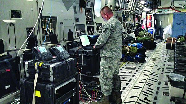 A member of the Joint Communications Support Element’s (JCSE's) 4th Joint Communications Squadron ensures the JACC/CP en route communications package is online and functioning correctly. Four members of JCSE’s 4th JCS provided en route communications to the U.S. Army’s 4th Infantry Brigade Combat Team (Airborne), 25th Infantry Division during a 14-hour flight from Joint Base Elmendorf-Richardson, Alaska to Australia during Talisman Saber 13.