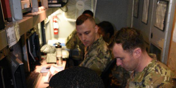 U.S. Army soldiers in a Joint Tactical Ground Station (JTAGS) at Osan Air Base, Korea, stand ready to provide early warning of missile launches. JTAGS units run by the Army Space and Missile Defense Command (SMDC) defend U.S. forces worldwide.  U.S. Army photo