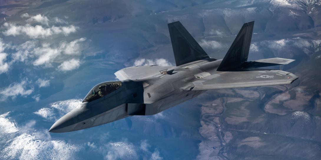 The Air Force’s Air Combat Command, newly in charge of the service’s Cyber Mission, is deploying specialized mission defense teams to protect particular weapon systems such as an F-22, pictured flying over Alaska during an exercise in May, or an F-35 or a key infrastructure component such as an air operations center. Credit: U.S. Air Force photo by Staff Sgt. Micaiah Anthony