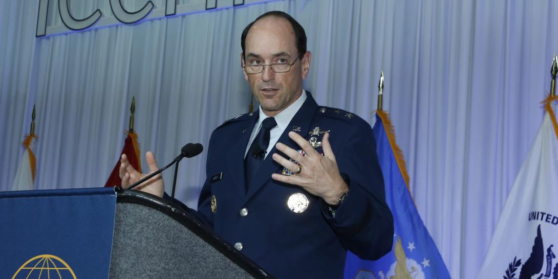 Maj. Gen. Kevin Kennedy, USAF, director of operations, U.S. Cyber Command, discusses the Joint Cyber Warfighting Architecture during a keynote presentation at TechNet Cyber 2022. Photo by Michael Carpenter
